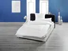 A neatly made bed with white bedding in a room with blue walls and a wooden floor. Produktbild-Vorschau