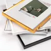 A stack of picture frames in different colors. Produktbild-Vorschau