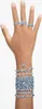 A hand adorned with multiple rings and bracelets. Produktbild-Vorschau