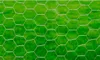 A close-up view of hexagonal wire mesh against a blurred green background. Produktbild-Vorschau