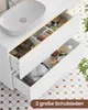 A bathroom vanity with an open drawer showing toiletries and towels, with a sink on top. Voir les images du produit