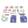 A collection of accessories for a Fujifilm Mini 11 instant camera, including patterned paper, frames, a journal, and a camera case, laid out on a white background. Náhled obrázku produktu