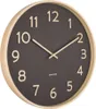 A close-up, angled view of a wall clock with a dark gray face and a light wood frame. Anteprima dell’immagine prodotto
