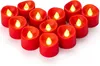 A collection of red LED tea lights arranged in a heart shape on a white background. Produktbild-Vorschau