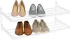 A white shoe rack with six pairs of shoes on it. Produktbild-Vorschau
