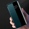 A hand holding a teal smartphone case with a transparent viewing window, showing the phone's screen with the time and date. Produktbild-Vorschau