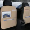 Interior of a car with seat back organizers attached to the back of the front seats. Voir les images du produit