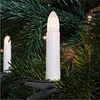 Close-up of LED candle lights clipped onto a Christmas tree. Produktbild-Vorschau