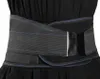 A close-up shot of a black lumbar support belt with blue stitching, worn over a black garment. Náhľad obrázku produktu