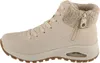 A side view of a single beige high-top sneaker. Voir les images du produit