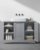 A grey bathroom vanity cabinet with a white sink and various bathroom products displayed. Produktbild-Vorschau