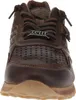 A close-up front view of a brown leather sneaker. Voir les images du produit