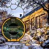 A house decorated with Christmas lights in the snow. Produktbild-Vorschau