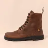 A side view of a brown leather boot. Voir les images du produit