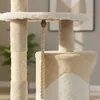 A close-up view of a beige and white cat tree with a sisal rope hanging down. Podgląd zdjęcia produktu