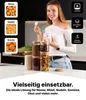 Frau, die ein Glas mit Marshmallows hält, umgeben von anderen Glasvorratsbehältern, gefüllt mit verschiedenen Trockenwaren Voir les images du produit