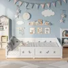 A child's bedroom with a white bed, decorated with stars and moons. Produktbild-Vorschau