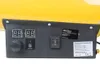 A close-up view of the control panel of a yellow gas heater, showing digital displays, a knob, a reset button, and a switch. Anteprima dell’immagine prodotto