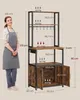 A woman stands next to a kitchen shelf unit with dimensions and weight capacities labeled. The unit has a vintage brown and black finish. Náhled obrázku produktu