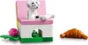 A LEGO set featuring a small dog on a pink bench, a bone, a green base with a food bowl, and a croissant. Náhled obrázku produktu