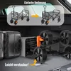 The image shows a foldable wagon being packed into a car trunk, illustrating its ease of storage. Produktbild-Vorschau