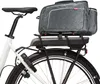 A close-up view of the rear of a white electric bicycle, focusing on the battery pack and a gray saddlebag mounted on the rear rack. Podgląd zdjęcia produktu