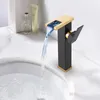 A modern black and gold waterfall faucet with LED lighting is shown in use, with water flowing into a white sink. Podgląd zdjęcia produktu
