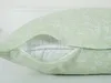 Close-up view of a pillowcase with a zipper partially open, revealing the inner pillow. Produktbild-Vorschau