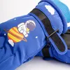 A close-up view of a pair of blue children's winter gloves with an astronaut and planet design. Produktbild-Vorschau