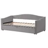A gray upholstered daybed with a pull-out trundle bed is shown against a white background. Náhľad obrázku produktu