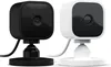 Two Blink Mini smart cameras, one black and one white, are shown on a white background. Podgląd zdjęcia produktu