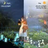 A split image showing a girl with a teddy bear holding a lantern in a garden at night on the left, and the same garden scene in daylight on the right, with glowing figures in the foreground. Produktbild-Vorschau