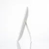 A side profile of a white makeup mirror with a stand, set against a plain white background with a reflection on the surface below. Podgląd zdjęcia produktu