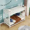 A white metal bunk bed with bedding and blankets in a child's room. Voir les images du produit