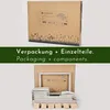 A cardboard box with product information and a disassembled children's furniture set. Anteprima dell’immagine prodotto