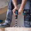 A person is using a cordless drill to drill into a wooden plank. Náhled obrázku produktu