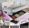 A white upholstered bed with storage, featuring LED lighting and a tufted headboard with USB ports. The image includes close-up insets highlighting specific features. Produktbild-Vorschau
