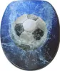 A toilet seat with a soccer ball design, with water splashing around it. Náhled obrázku produktu