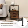 A bedside table with two drawers and side pockets is placed next to a sofa in a living room setting. Produktbild-Vorschau