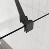 A close-up view of a black metal hinge mechanism on a shower screen, set against a white tiled background. Anteprima dell’immagine prodotto