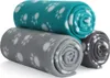 Three rolled-up fleece blankets with paw print patterns are stacked on a white background. Náhled obrázku produktu