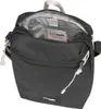 A black Pacsafe crossbody bag is shown from a slightly elevated front-facing angle, with the main compartment open to reveal the interior. Anteprima dell’immagine prodotto