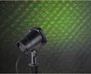 A black laser light projector is shown in front of a green background with red and green laser dots projected onto it. Anteprima dell’immagine prodotto