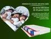 A family sleeping in a heart-shaped frame, with a mattress cutaway shown below and promotional text. Anteprima dell’immagine prodotto