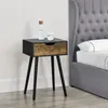 A bedside table next to a bed. Náhled obrázku produktu