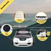 A white race car-themed bed is shown on a road with mountainous scenery in the background. Several callouts highlight features of the bed. Produktbild-Vorschau
