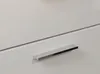 A close-up view of a white cabinet with a silver handle. Produktbild-Vorschau