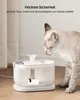 A cat is drinking from a pet water fountain. Produktbild-Vorschau