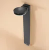 A black solar stand light is mounted on a light beige wall. Produktbild-Vorschau