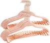 A stack of pink velvet hangers with rose gold clips, presented against a white background. Produktbild-Vorschau